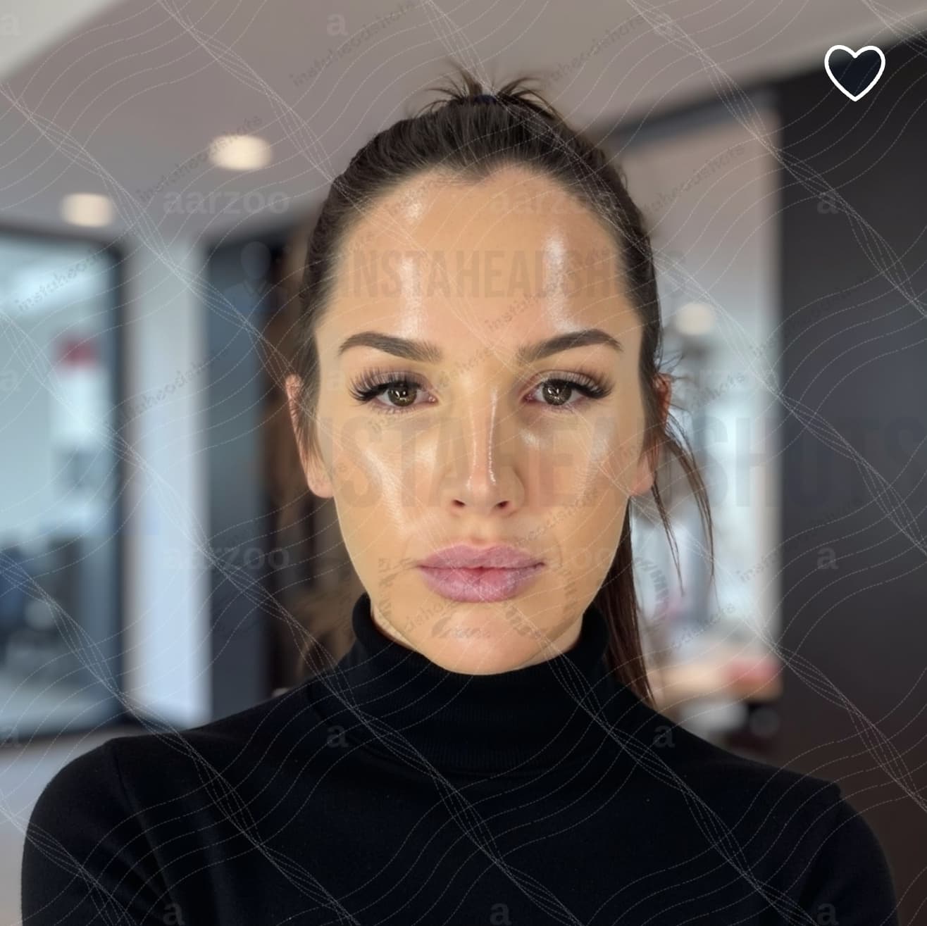 Woman with brown hair in a ponytail wearing a black turtleneck against a blurred background.